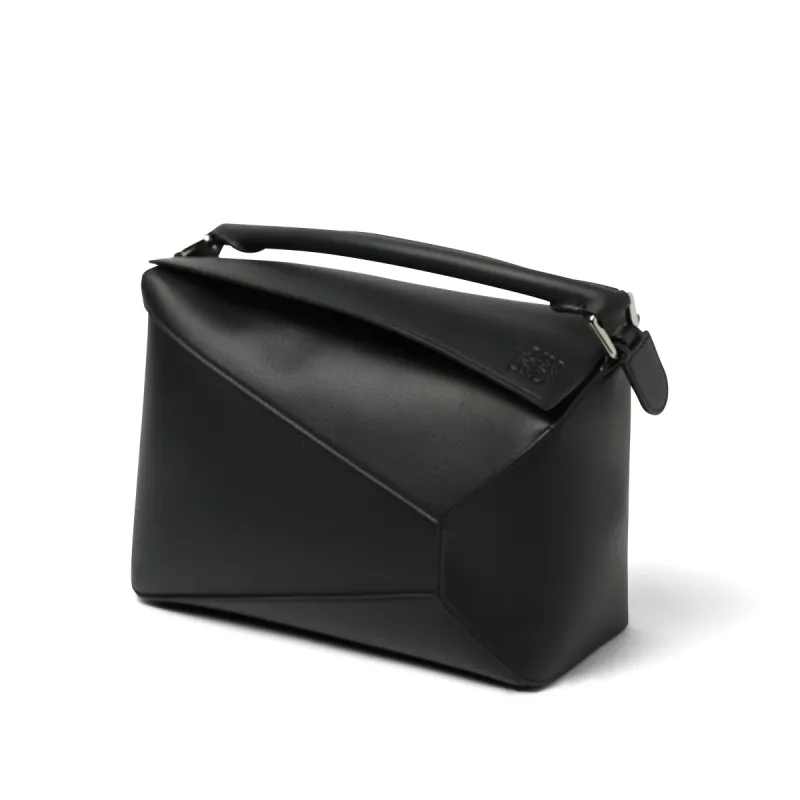 Puzzle Edge Bag in Black sold by MARAIS