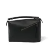 Puzzle Edge Bag in Black sold by MARAIS