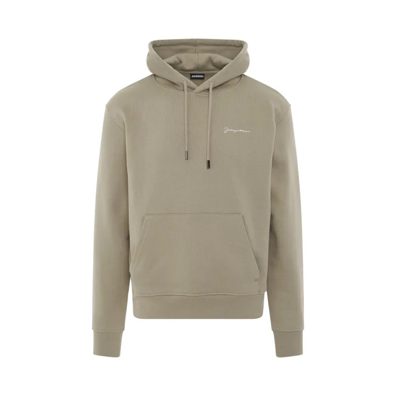 Signature Embroidered Logo Hoodie in Light Khaki sold by MARAIS