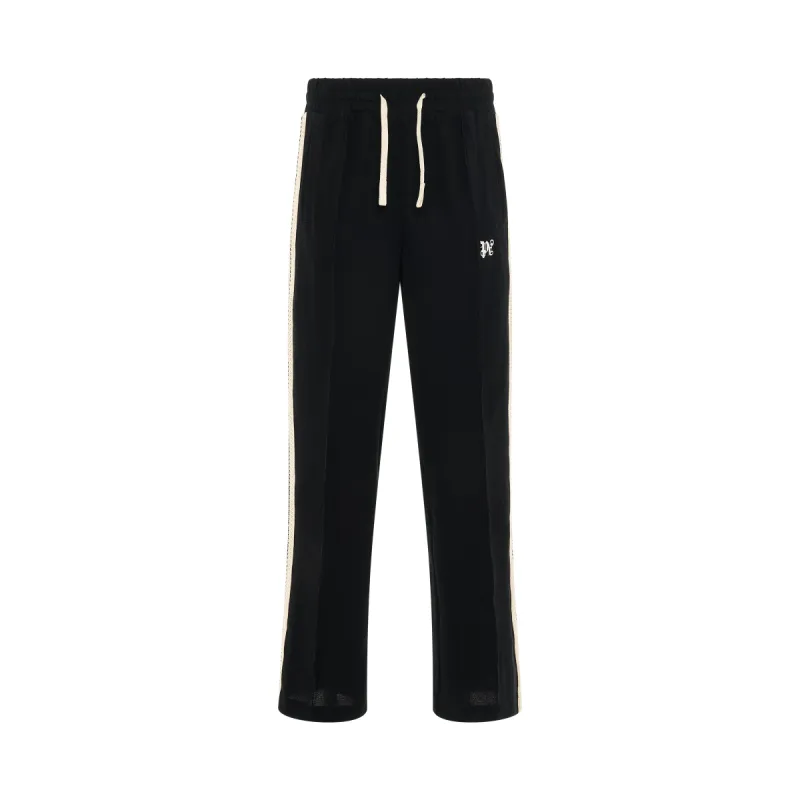 Monogram Piquet Track Pants in Black sold by MARAIS