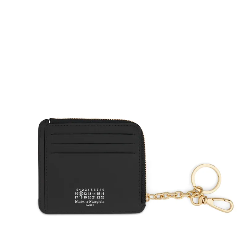 4 Stitch Key Chain Purse in Black sold by MARAIS
