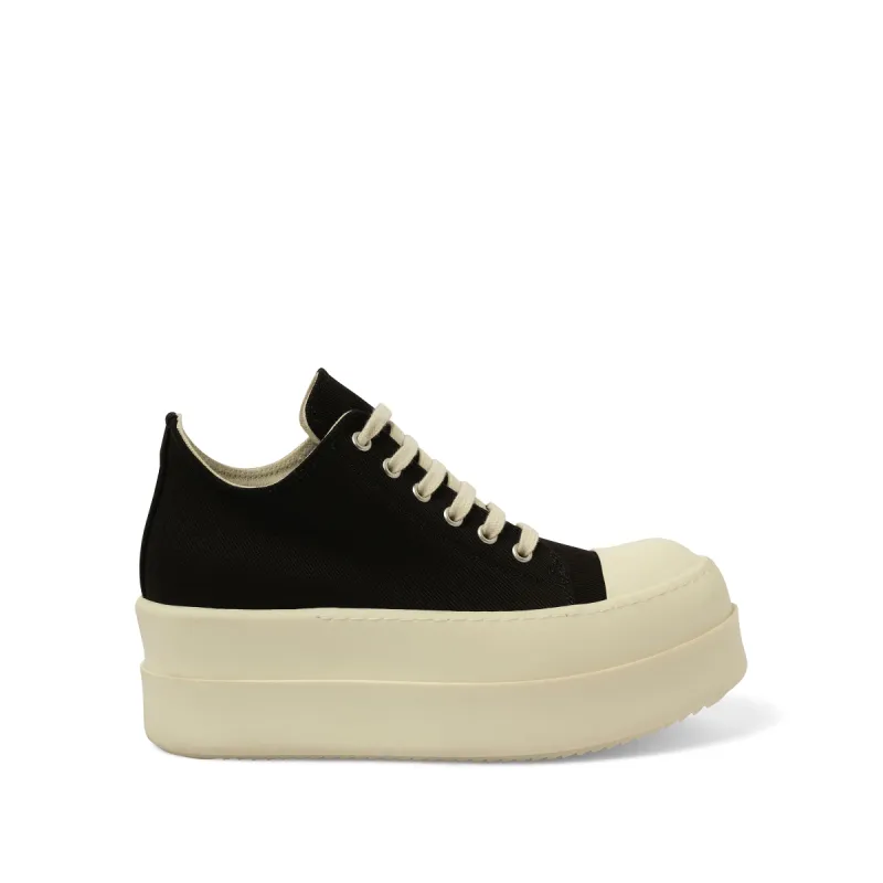 Double Bumper Low Sneaks in Black/Milk sold by MARAIS