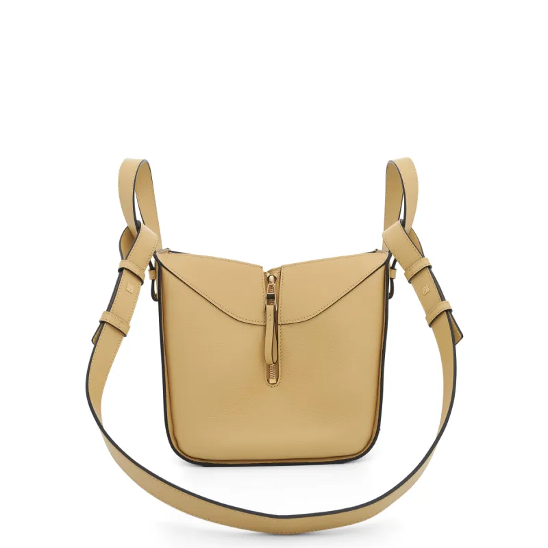 Compact Hammock Bag in Soft Grained Calfskin in Dark Butter sold by MARAIS