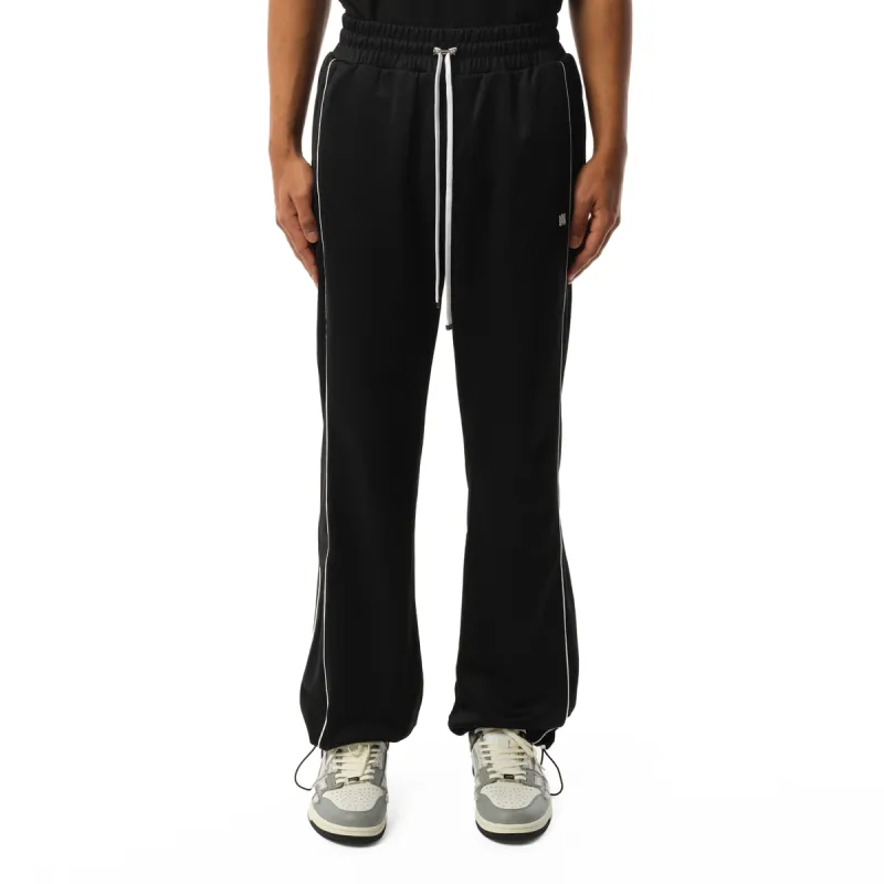 MA Flare Track Pants in Black sold by MARAIS