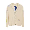B12 Patch Oversized Knit Cardigan in Yew sold by MARAIS