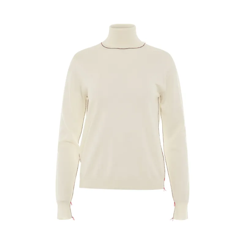 Work in Progress High Neck Sweater in Ecru sold by MARAIS