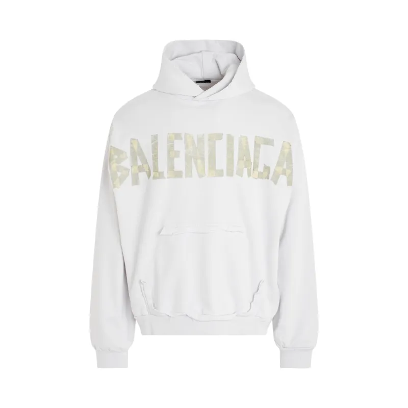 Tape Logo Ripped Pocket Hoodie in White sold by MARAIS
