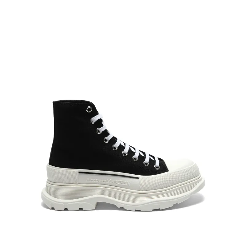 Tread Slick Canvas Lace-Up Boots in Black/White sold by MARAIS