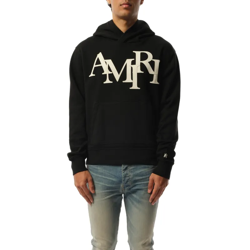 Amiri Staggered Hoodie in Black/White sold by MARAIS