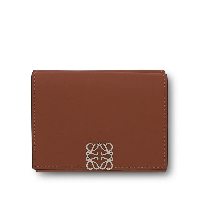 Anagram Trifold Wallet Pebble Grain Calfskin in Tan sold by MARAIS
