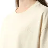 Amiri Embroidered Cropped T-Shirt in Alabaster sold by MARAIS