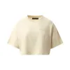 Amiri Embroidered Cropped T-Shirt in Alabaster sold by MARAIS