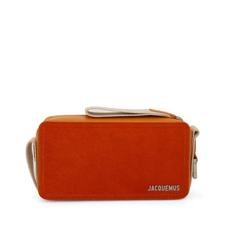 Le Cuerda Horizontal Leather Bag in Orange sold by MARAIS