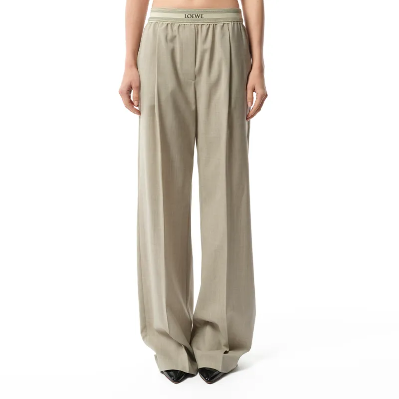 Logo Band Trouser in Light Beige Melange sold by MARAIS