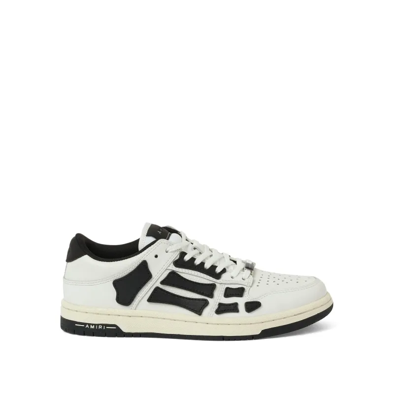 Skeleton Low Top Sneaker in White/Black made by AMIRI