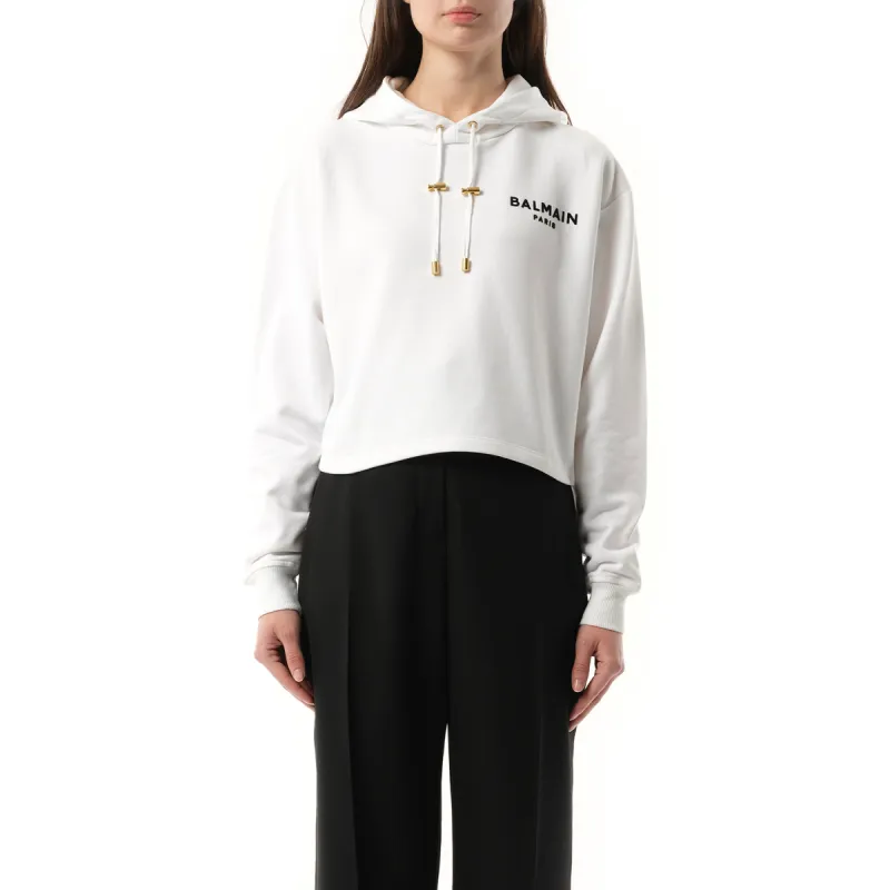 Balmain Flock Detail Cropped Hoodie in White/Black sold by MARAIS