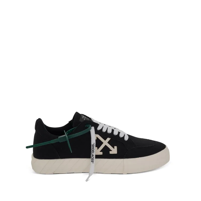 Low Vulcanized Canvas Sneakers in Black/White sold by MARAIS