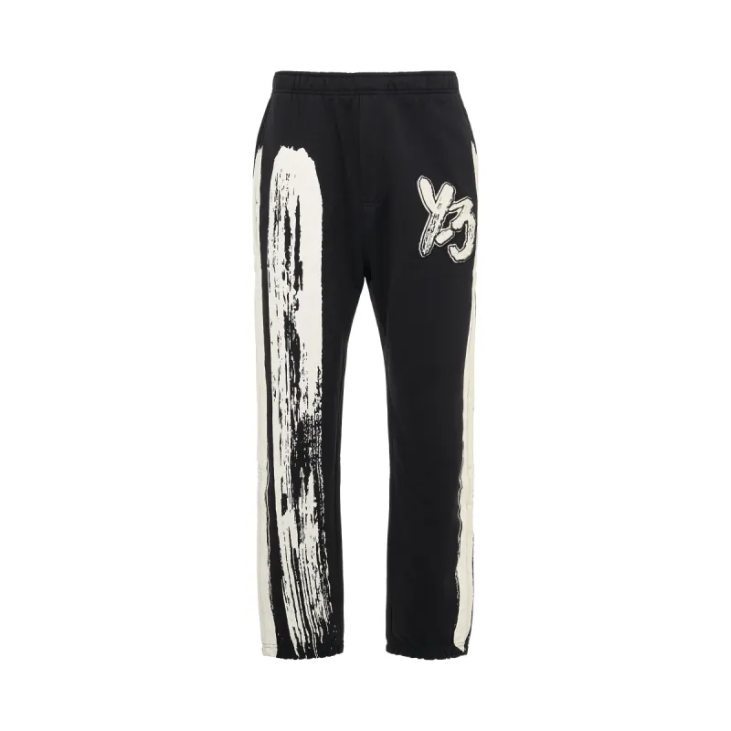 Logo Print Track Pants in Black/Cream White sold by MARAIS