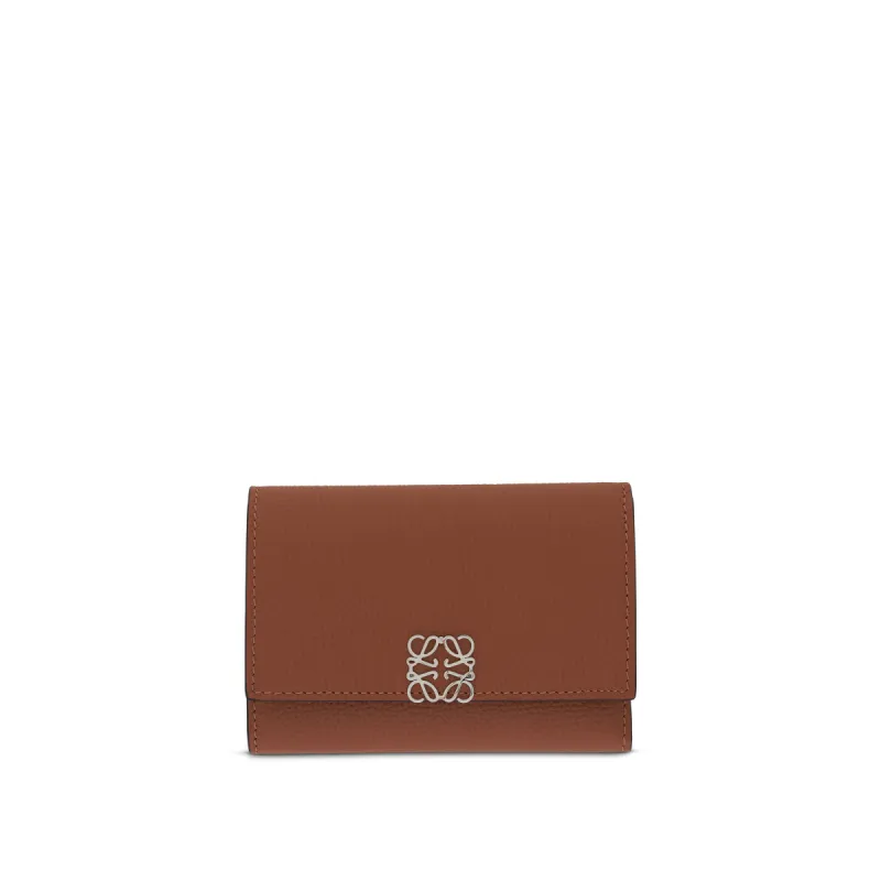 Anagram Small Vertical Wallet in Pebble Grain Calfskin in Tan sold by MARAIS