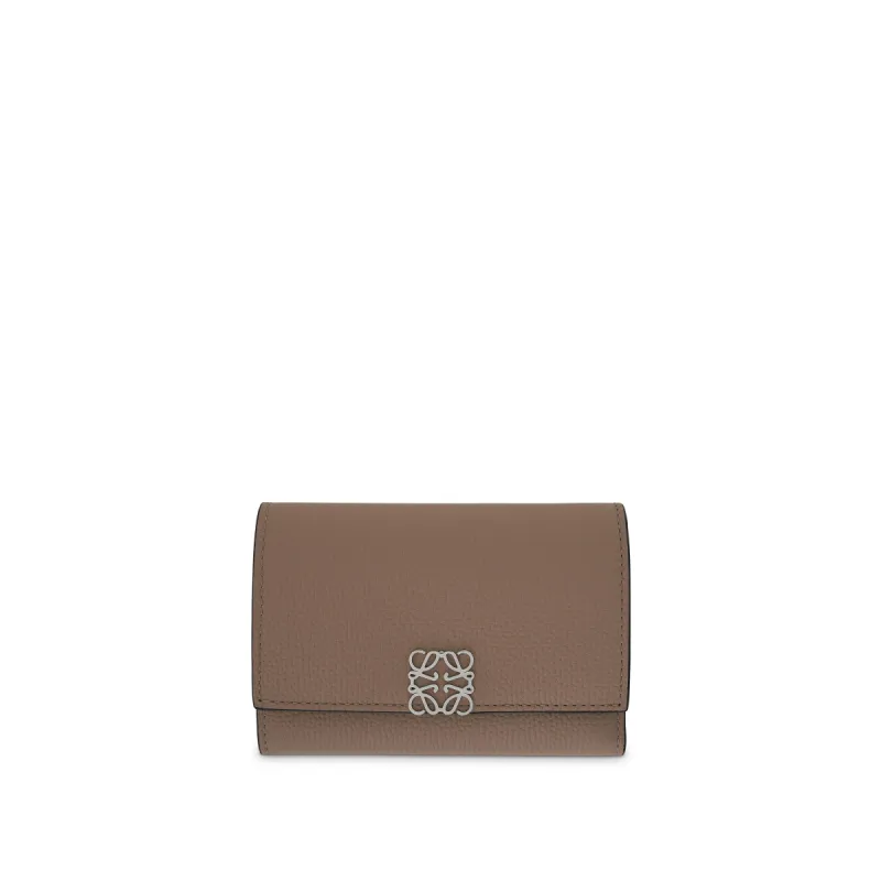 Anagram Small Vertical Wallet in Pebble Grain Calfskin in Sand sold by MARAIS