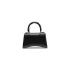 Hourglass XS Handbag in Box Calfskin in Black sold by MARAIS