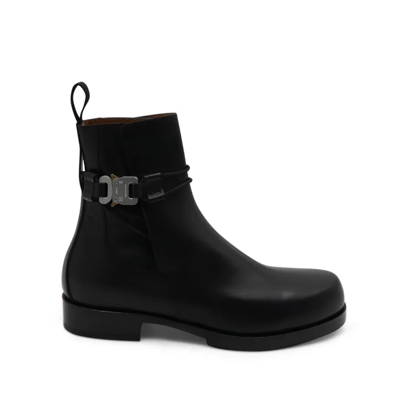 Low Buckle Leather Boots in Black sold by MARAIS