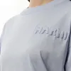 Embossed Logo T-Shirt in Illusion Blue sold by MARAIS