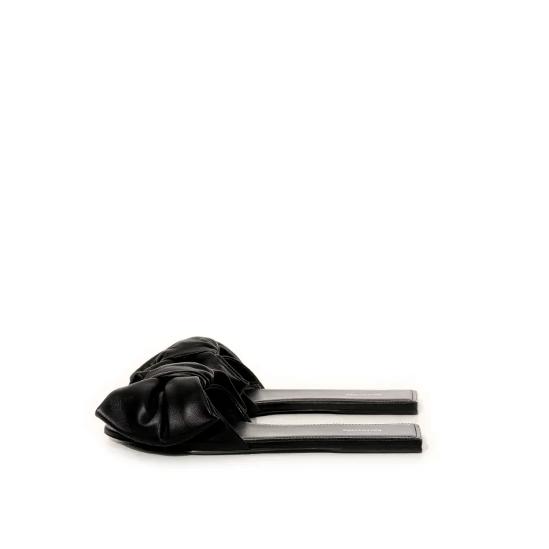 Lea Bow Flat Sandal in Black sold by MARAIS