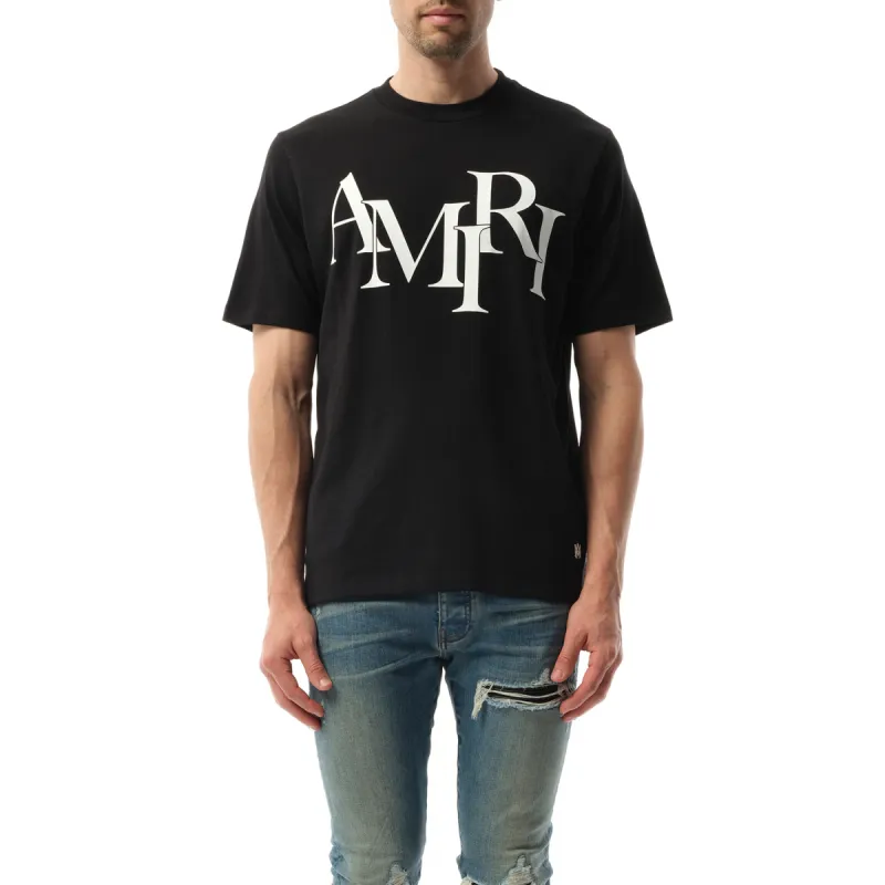 Amiri Staggered Logo T-Shirt in Black sold by MARAIS