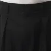 Pleated Tapered Pants in Black sold by MARAIS