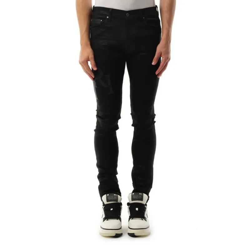 Waxed Staggered Logo Skinny Jeans in Black Wax made by AMIRI