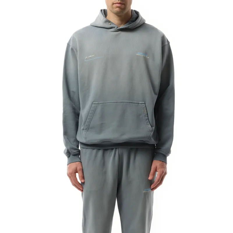 Patron of The Club Hoodie in Washed Grey sold by MARAIS