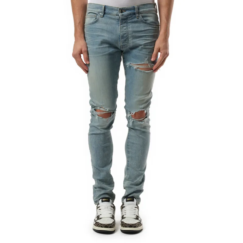 Distressed MX1 Jeans in Surf Indigo made by AMIRI