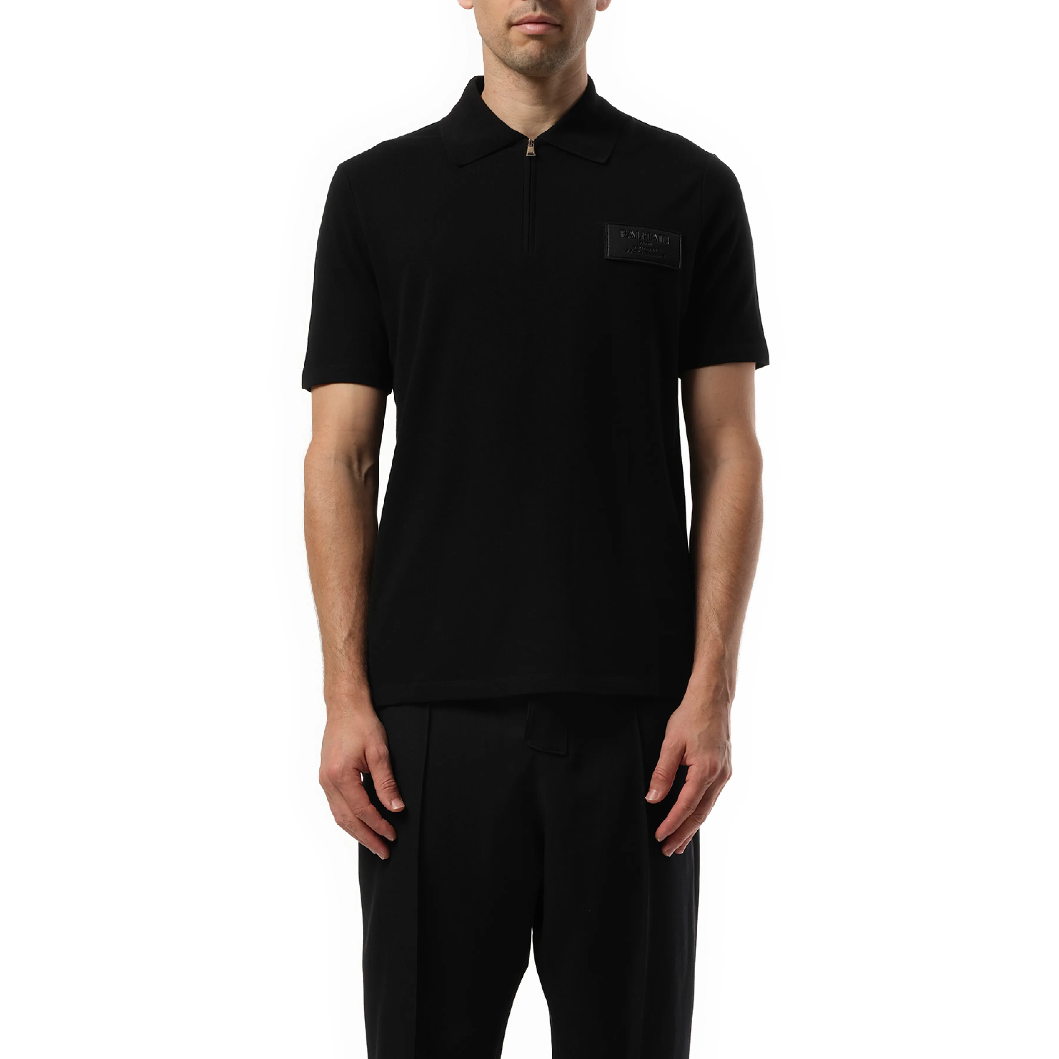 Small Leather Couture Label Zipped Polo in Black sold by MARAIS