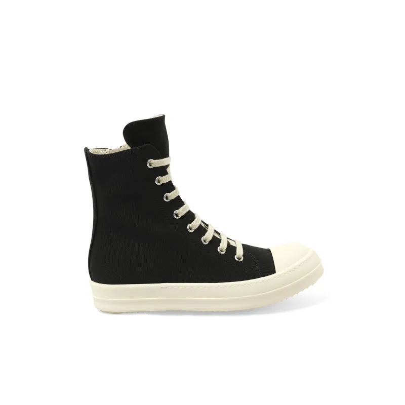 Canvas Sneaks in Black/Milk sold by MARAIS