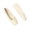 Little Bow Ballerina in Limestone sold by MARAIS