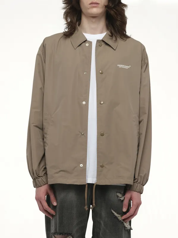 Undercover Coach Jacket in Beige sold by MARAIS