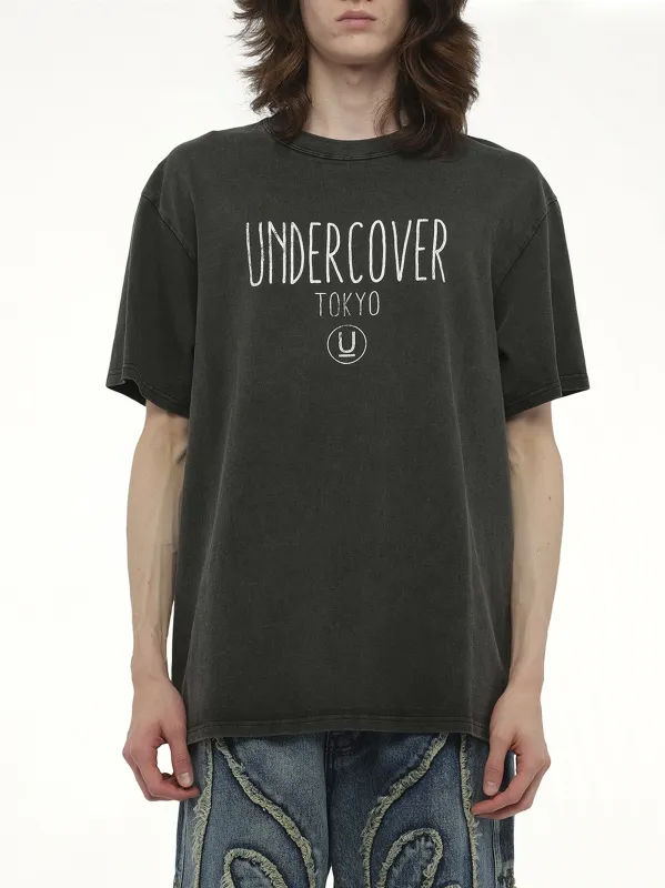 Undercover Tokyo T-Shirt in Charcoal sold by MARAIS