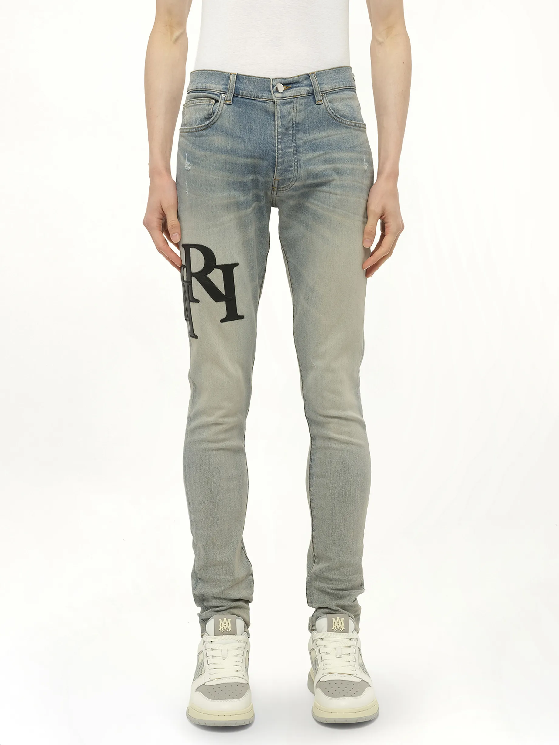 Staggered Logo Skinny Jeans in Antique Indigo/Black sold by MARAIS