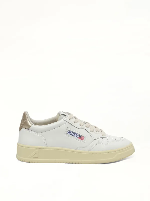 Medalist Low Sneakers in White/Gold sold by MARAIS