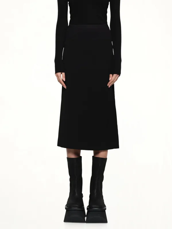 Knee Bias Light Skirt in Black sold by MARAIS
