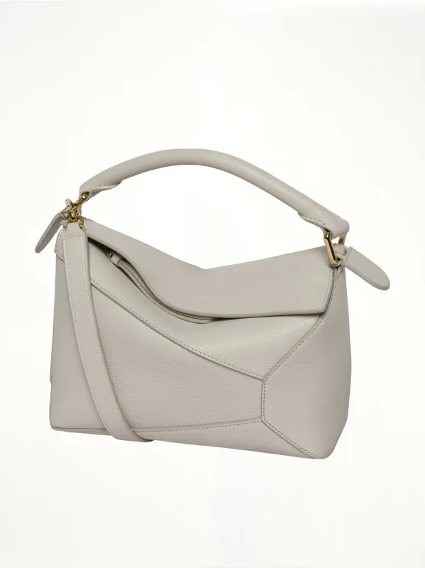 Puzzle Edge Small Bag in Light Ghost sold by MARAIS