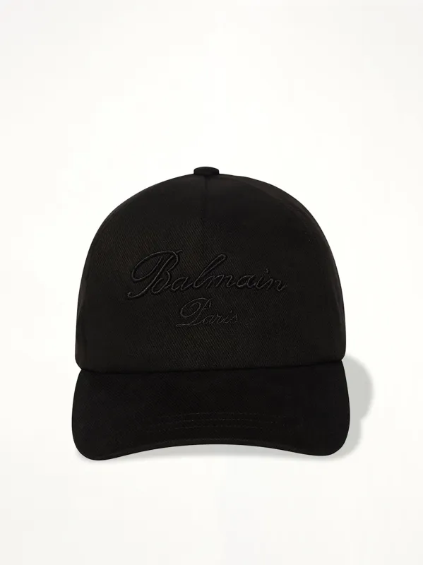 Balmain Signature Cotton Cap in Black sold by MARAIS