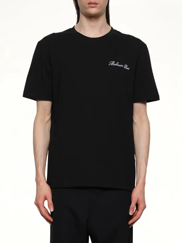 Balmain Signature Embroidered T-Shirt in Black/White sold by MARAIS