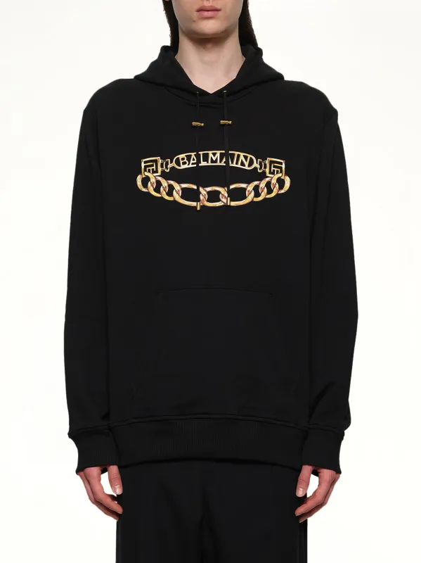 Balmain Chian Logo Hoodie in Black/Gold sold by MARAIS