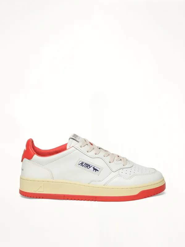 Maison Kitsune Medalist Sneaker in White/Red sold by MARAIS