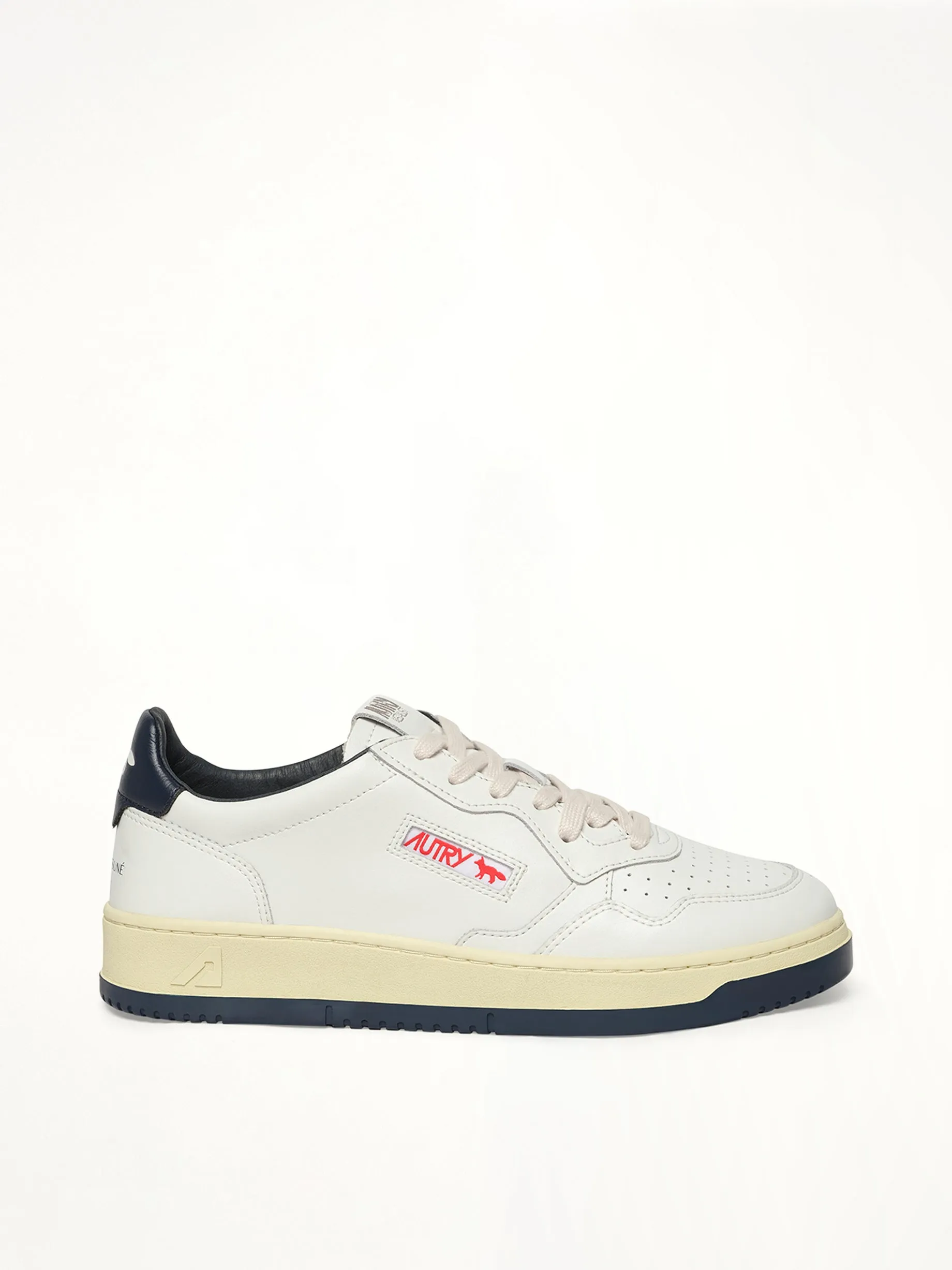 Maison Kitsune Medalist Sneaker in White/Blue sold by MARAIS