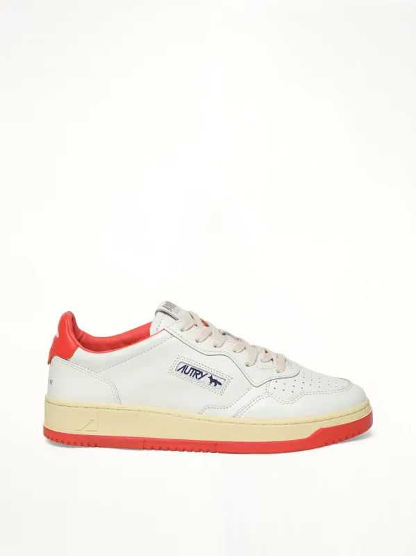 Maison Kitsune Medalist Sneaker in White/Red sold by MARAIS