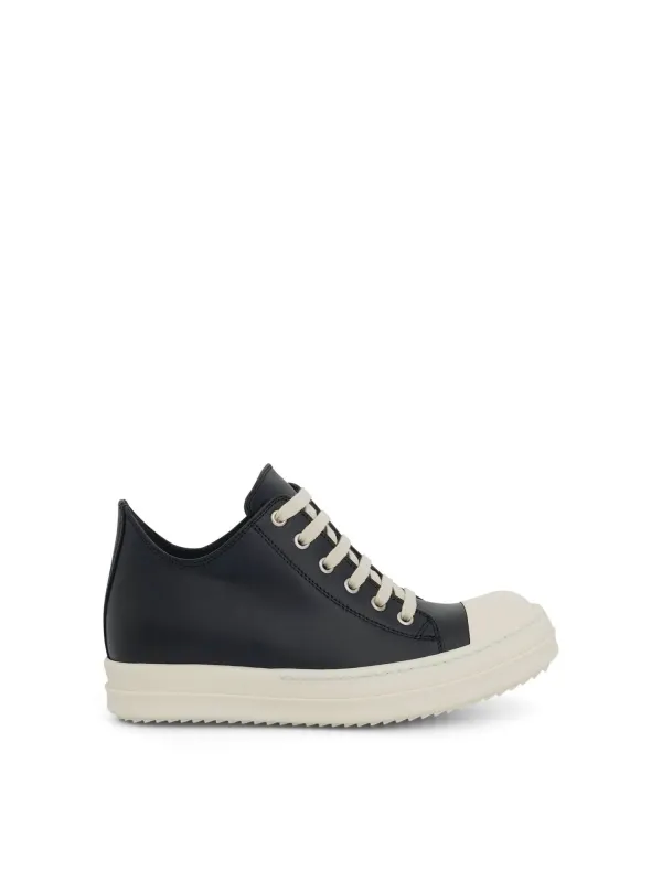 Low Leather Sneaker in Black/Milk sold by MARAIS
