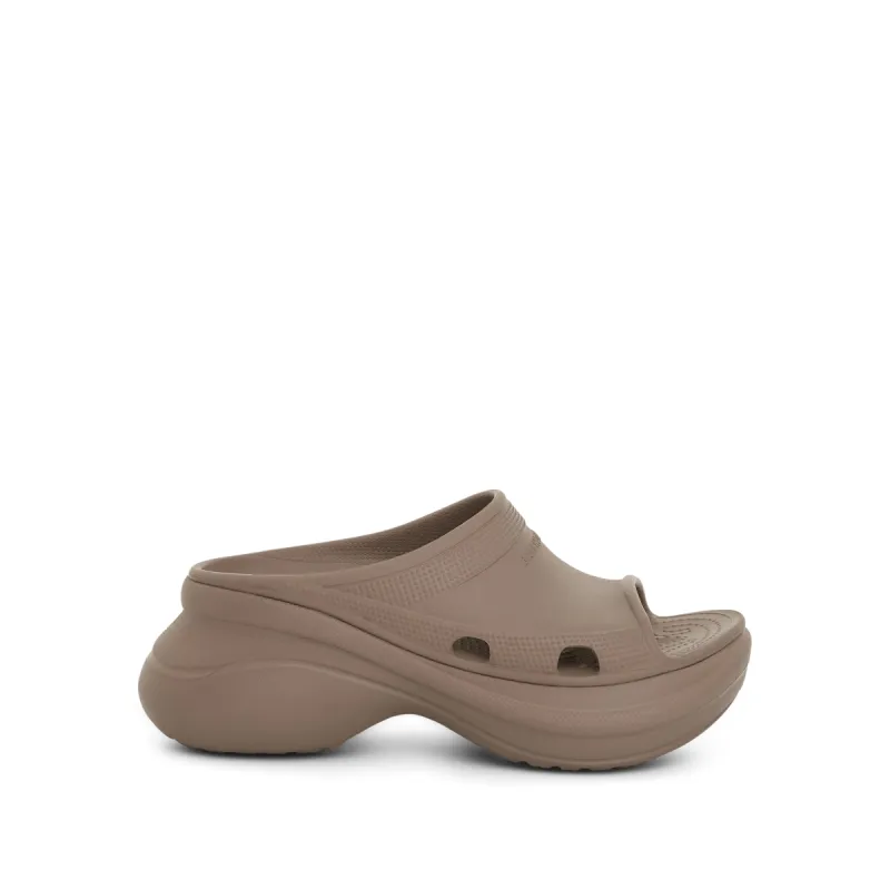 Crocs Pool Slide Sandal in Beige sold by MARAIS
